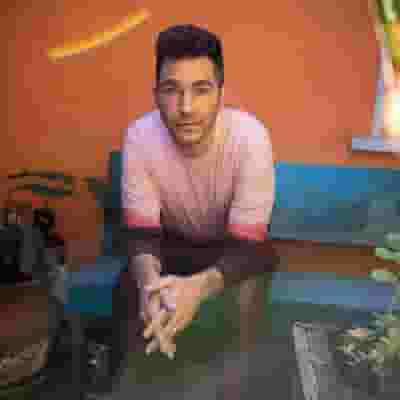 Andy Grammer blurred poster image