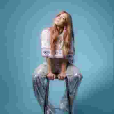 Becky Hill blurred poster image